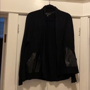 cute black sweater with vegan leather pockets!